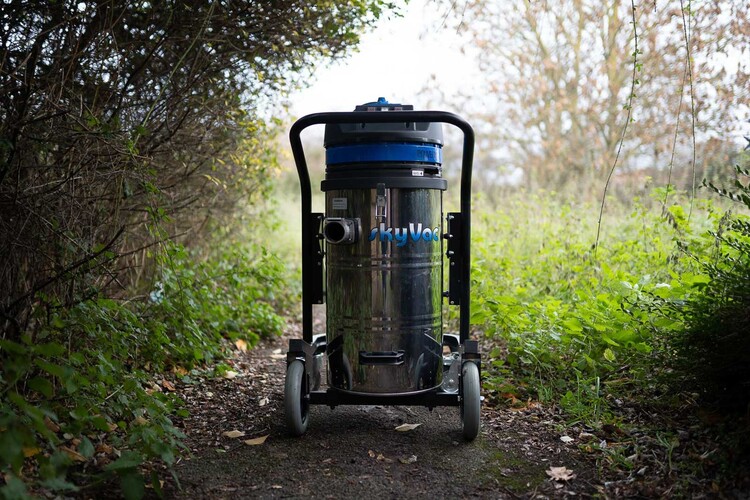 SkyVac industrial wet and dry vacuum gutter cleaning system with wheels positioned on outdoor path, showing professional ground-based high-reach equipment used in Nottingham