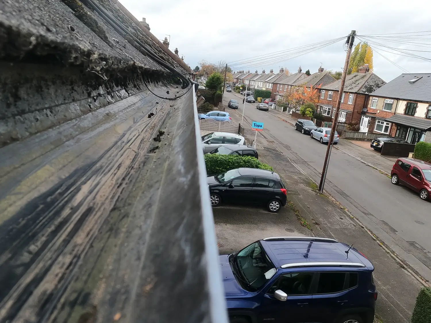 After: front gutter of a 1930s semi on Eltham Road, West Bridgford, cleared to bare metal along the full run